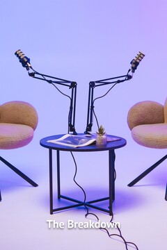 Two,modern,chairs,with,microphones,set,up,for,a,podcast